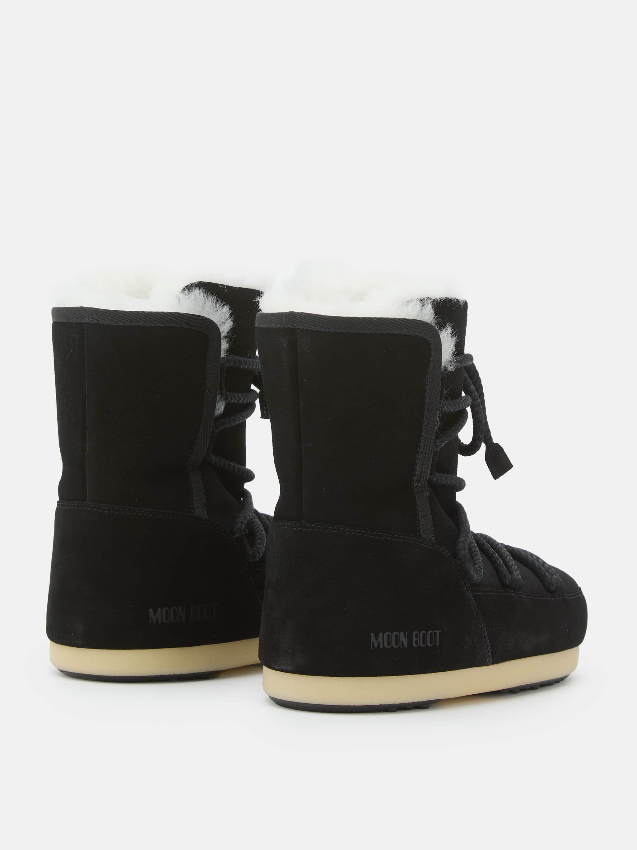 BOTTES EVX EN DAIM NOIR ET SHEARLING